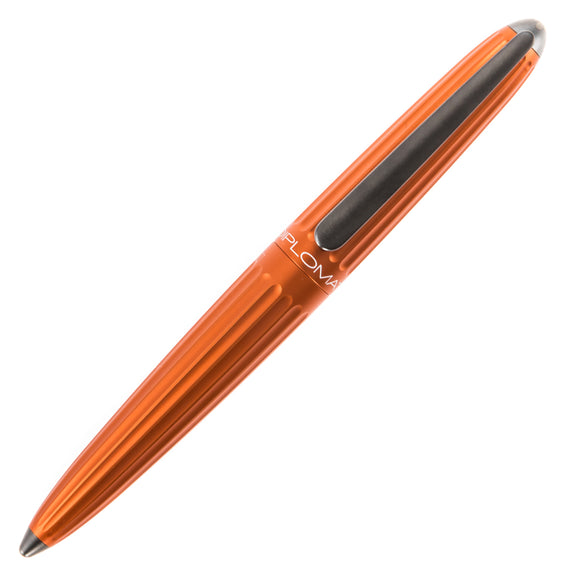 Orange pen with black accents on a white background
